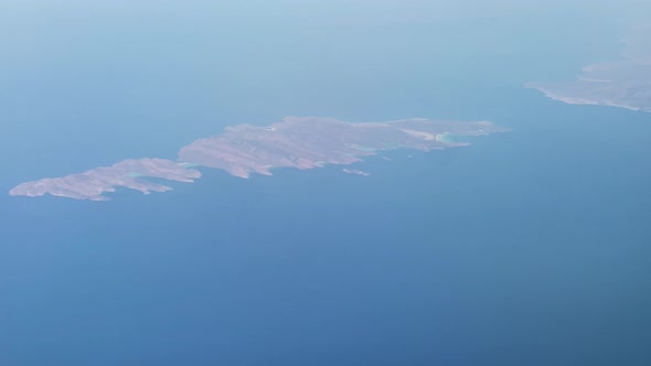 View out of an airplane window while flying over Mexico