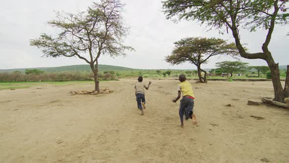 African children playing with wheels alt