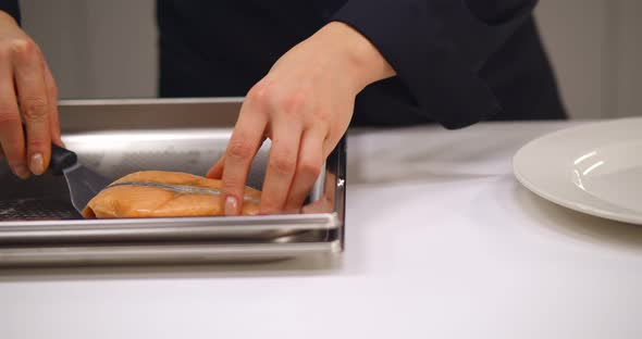 Chef Serving Dish Salmon Steak Fillet and Garnished with Wild Asparagus