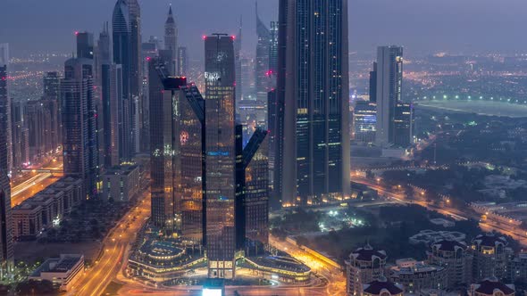 Dubai International Financial Centre District with Modern Skyscrapers Night to Day Timelapse
