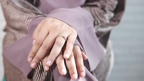 Close Up of Women's Hands with Wedding Ring