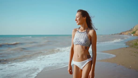 Slow Motion of Happy Joyful Slim Fitbody Woman Wearing in Bikini and Enjoying Wind and Waves on Sea