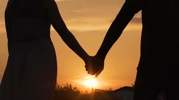 Couple Separating Their Hands at Sunset, Love Story Ending, Family Break-Up