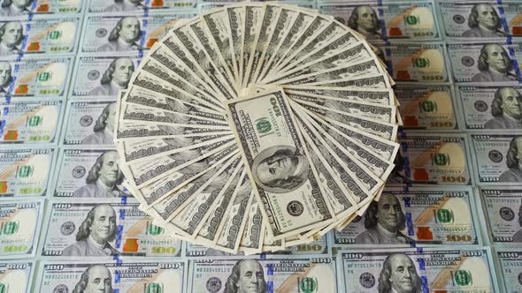 Background of american money. Rotation of one hundred dollar money bills.