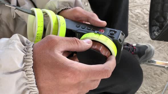 focus puller hands at work close up