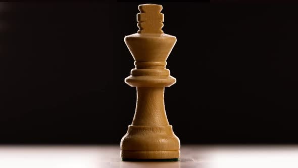 Close Up of Chess Pieces Against Black Background