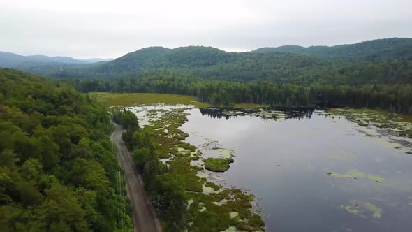 Drone Flying Above Green Hilltops