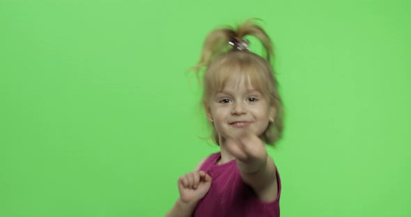 Girl in Purple Dress Dancing and Claps in Her Hands. Happy Child. Chroma Key