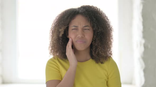 Sick African Woman having Toothache