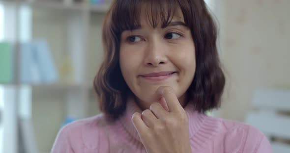 Headshot portrait of Thoughtful Young Woman with happy