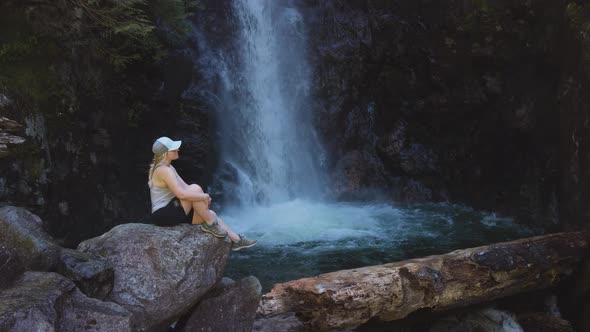 Adult Woman Hiker at Norvan Falls and River Stream in the Natural Canyon