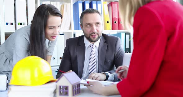 Group of Architects Discussing Documents with House Project in Office  Movie