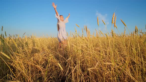 Beauty Girl Running on Yellow Wheat Field, Freedom Concept, Happy Woman Outdoors, Harvest.