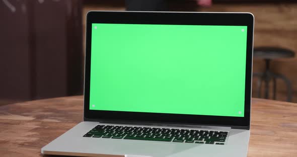 Parallax Shot of Modern Laptop with Green Screen