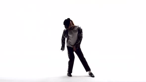 Young Stylish Teenager Is Showing Dance Moves Like Michael Jackson. Isolated Over White Background.