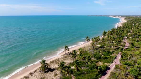 Aerial View of Tropical White Sand Beach and Turquoise Clear Sea Water with Small Waves