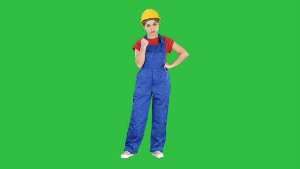 Angry woman construction worker shows fist Negative aggressive