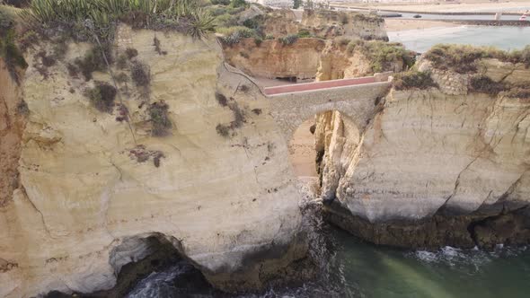 Arch bridge at Praia dos Estudantes (Students Beach) in Lagos, Algarve. Aerial view