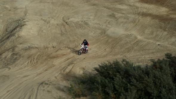 Enduro Motorcycle Rides Offroad on the Sands