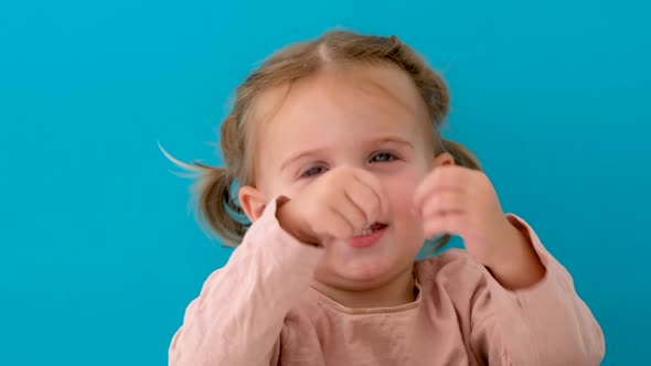 Beautiful Little Girl Hiding in Studio