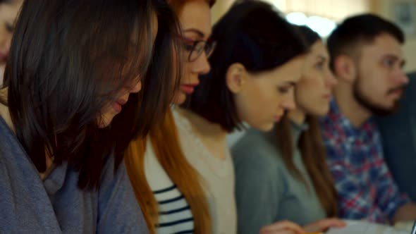 Female Student Turns Her Face at the Lecture Hall