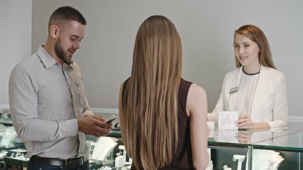 Couple Buying Jewelry in Designer Boutique