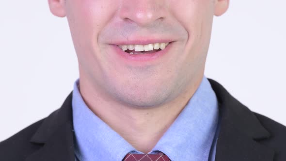 Closeup of Young Happy Businessman Smiling