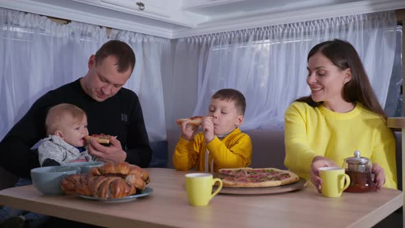 Picnic Trip Parents Eat Fast Food with Little Boys During Joint Trailer Journey on Family Weekend