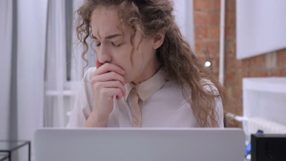 Portrait of Sick Female Coughing while Working on Laptop, Infection