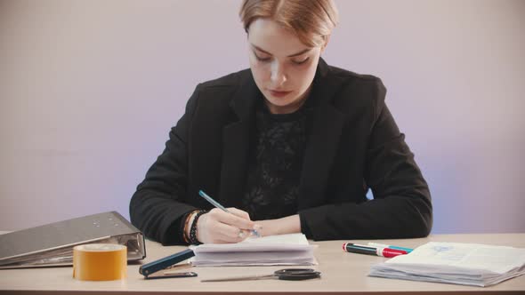 Very Tired Young Woman Is Signing a Documents and Than Throwing All Off the Table