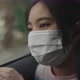 Asian Girl In Car Wearing A Medical Mask During Pandemic Of Coronavirus Covid-19 - VideoHive Item for Sale