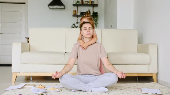 Mother Doing Yoga Exercise at Home for Stress Relief Relaxing While Her Child Little Daughter