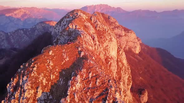 fly away footage of hikers on top of a high mountain in northern Italy, Corni Di Canzo