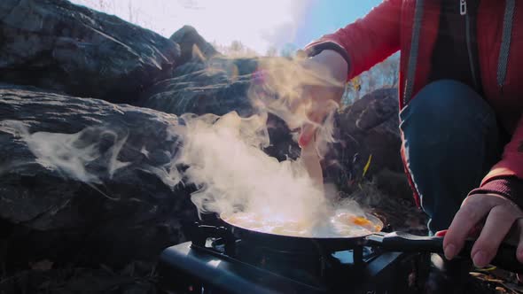 Woman Traveller Cooks Eggs