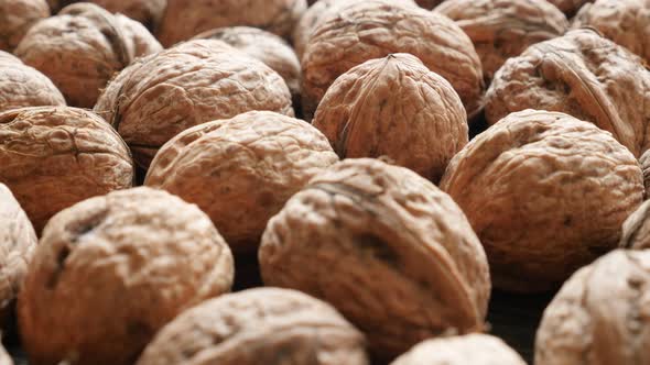 Food background Juglans  genus walnut fruit  shells  4K 3840X2160 30fps UHD panning footage - Lot of