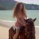Free Confident Woman Riding Horse on Seaside - VideoHive Item for Sale
