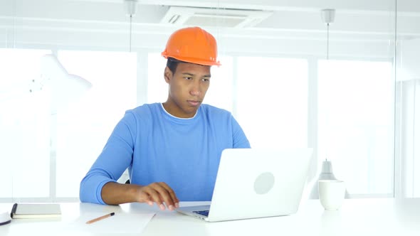 Afro-American Engineer Writing in Office, Documentation