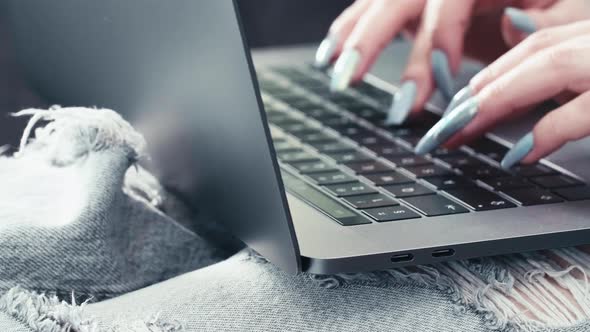 long nails sexy secretary hands close up typing on keyboard laptop device, work from home with fast