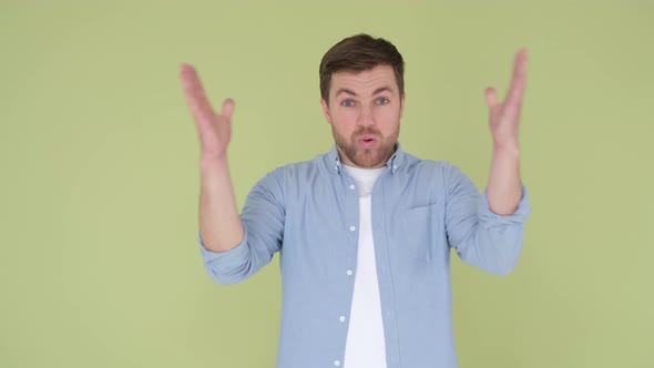 Man in Casual Blue Denim Shirt Looking Shocked Surprised Wow Showing Hands Head Blast Brain Isolated