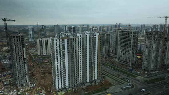 Construction of modern multi-storey buildings. Construction of a new city block.