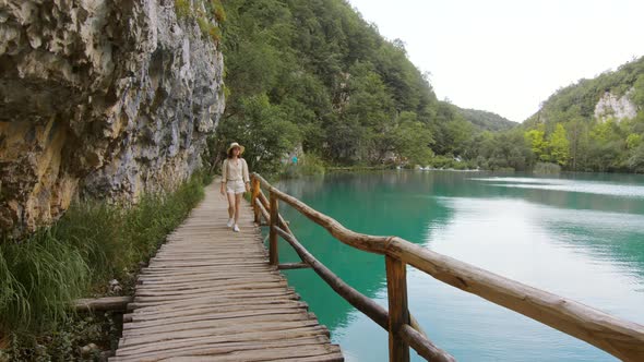 Young woman walking by Plitvice Lakes