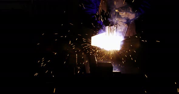 Welder welding a metal