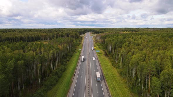 Aerial View of a Suburban Asphalt Road with Trucks