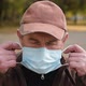 Close Up Portrait Elderly Man Puts a Medical Mask on His Face - VideoHive Item for Sale