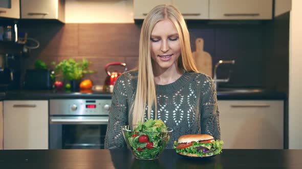 Young Lady Preferring Hamburger To Salad.