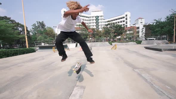 Skateboard Deck And Wheels Spinning On A Pavement