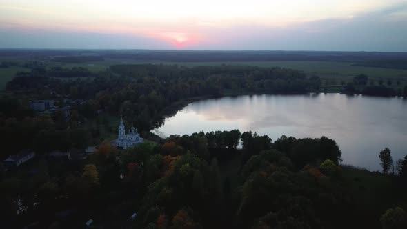 Stameriena Palace, Stameriena Lake at Sunset Aerial View in Autumn, Orthodox Church in Background.