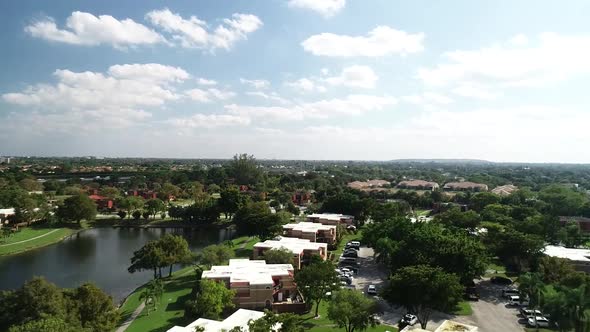 60fps (could be slow motion) aerial view of a neighborhood in Boca Raton Florida, USA