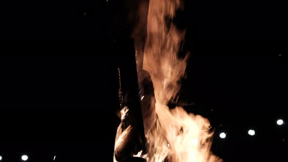 Big Bonfire Burns at Night in Slow Motion on a Black Background on Nature