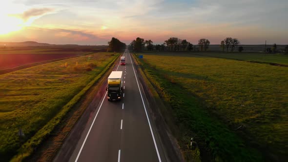 Amazing Aerial Drone View Semi Trucks Delivering Goods By Road